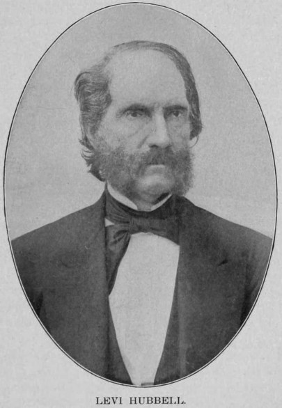 A black and white portrait  of Judge Levi Hubbell, wearing a suit. He's balding and has mutton chop facial hair. 