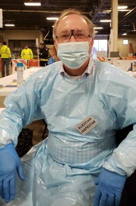 Robin Vos volunteers at a polling place in 2020 wearing full PPE.